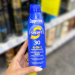 A Person Holding the Coppertone Sport 30 SPF Spray Sunscreen at CVS