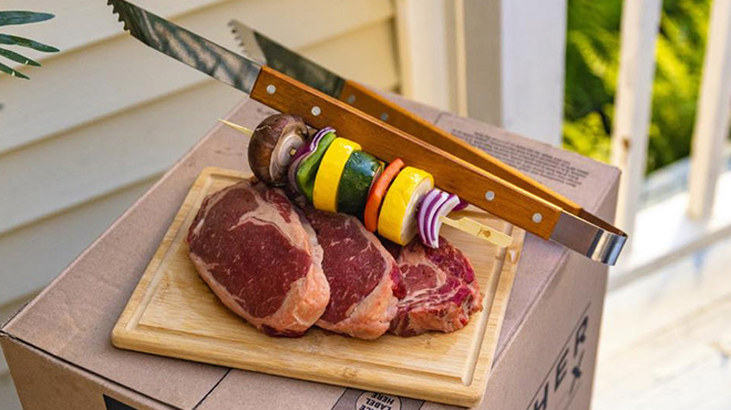 Barbeque Clippers Vegetable Kebab and Raw Meat on a Wooden Cutting Board on top of a ButcherBox