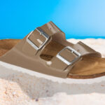 Birkenstock Womens Birko Flor Patent Sandals in Brown on the Sand