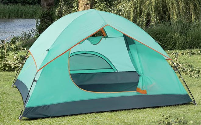 Empty 6 Person Camping Tent in Teal Color on a Grass
