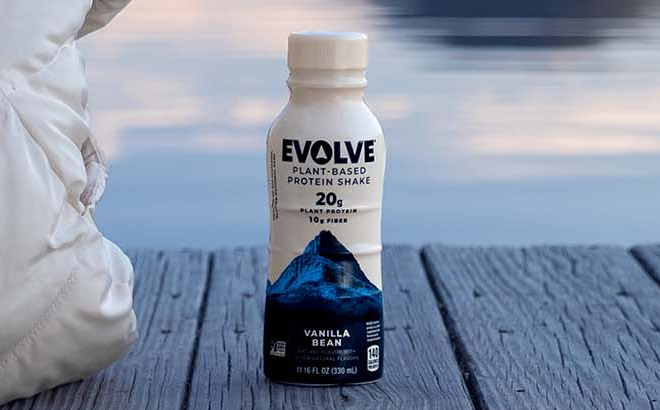 Evolve Plant Based Protein Shake Vanilla Bean Flavor Bottle on Wooden Surface