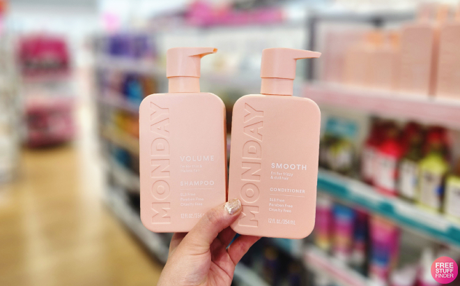Hand Holding Monday Haircare Smooth Shampoo Conditioner Set