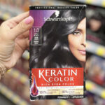 Hand Holding Schwarzkopf Keratin Hair Color Cream