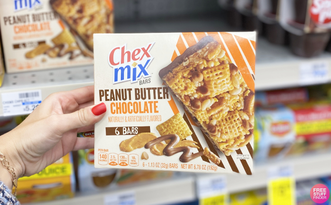 Hand Holding a Box of Chex Mix Peanut Butter Chocolate Bars