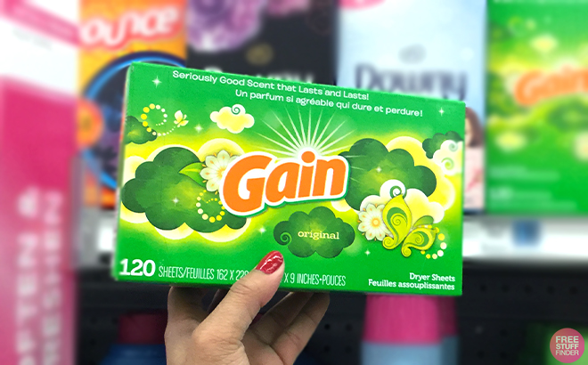 Hand Holding one Gain Dryer Sheets 120 Counts