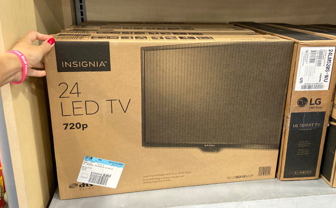 Hand Touching Insignia 24 Inch LED TV in a Box