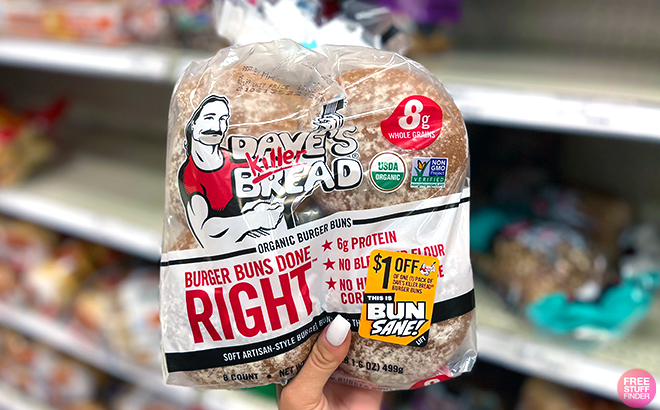 Hand holding Daves Killer Bread White Burger Buns Done Right Hamburger Buns Hand holding Daves Killer Bread White Burger Buns Done Right Hamburger Buns