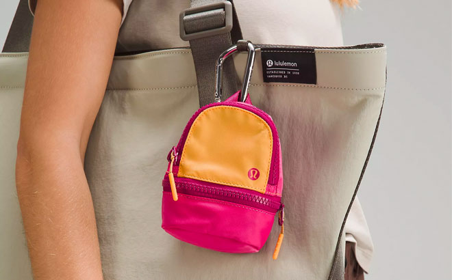 Model Wearing Lululemon Nano Backpack Attatched to a Large Tote Bag