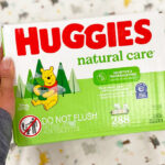 Person Holding Box of Huggies Baby Wipes 352 Count