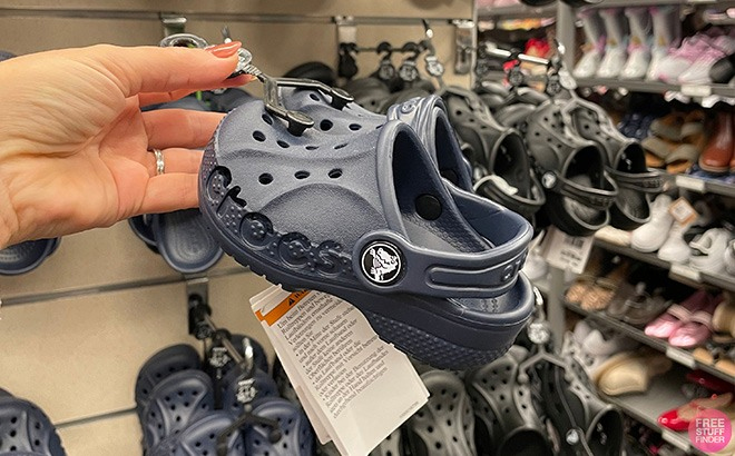 Person Holding Crocs Toddler Baya Clogs in Navy Color