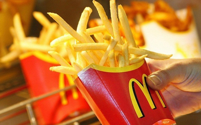 Person Holding McDonalds Large Fries