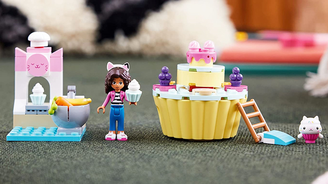 Pieces of LEGO Gabbys Dollhouse Bakey with Cakey Fun Set on a Table