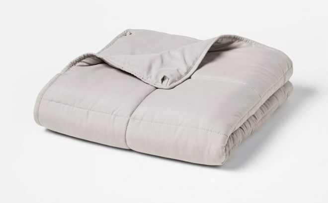 Room Essentials Weighted Blanket on a Gray Background