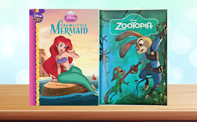 The Little Mermaid and Zootopia Hardcover Books on a Tabletop