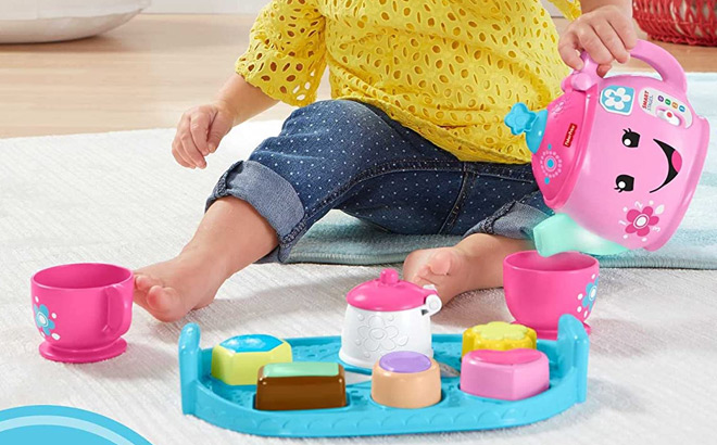 Toddler Playing with Fisher Price Laugh Learn Toddler Toy Sweet Manners Tea Set