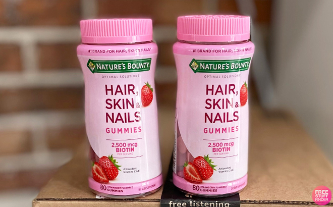 Two Bottles of Natures Bounty Hair Skin and Nails 80 Count Gummies on a Box