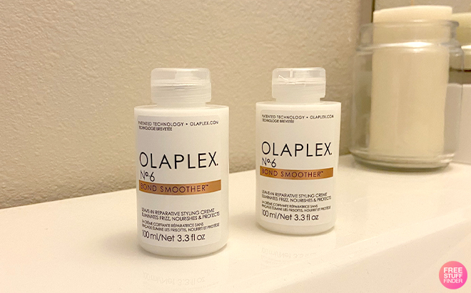 Two Bottles of Olaplex No 6 Bond Smoother on Bathroom Sink