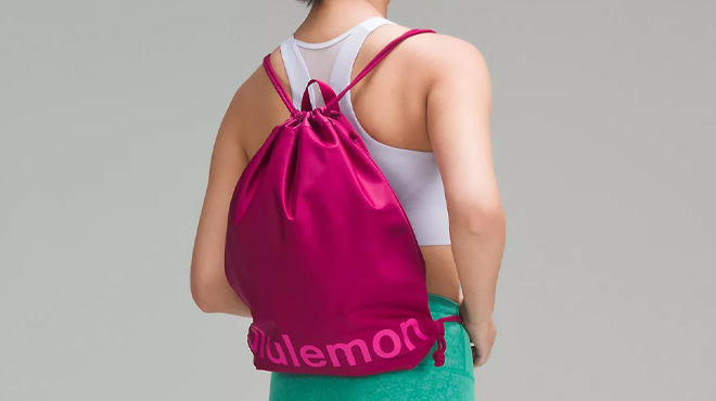 Woman Wearing Lululemon Lightweight Gym SackWild Berry Sonic Pink Color