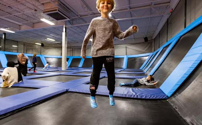 a Boy Playing at Top Flight Trampoline