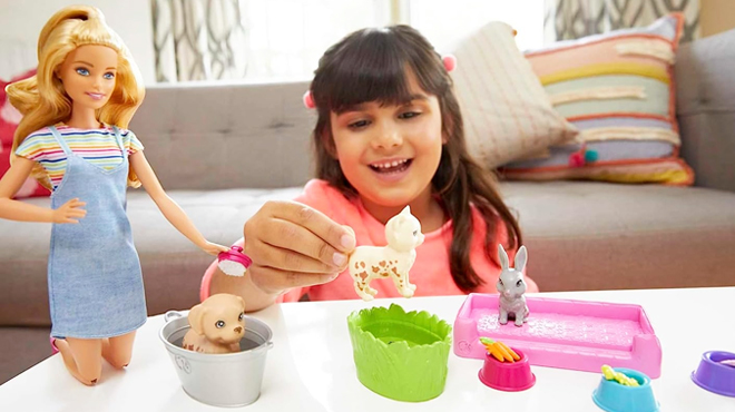A Girl Playing with Barbie Play N Wash Pets Doll Playset