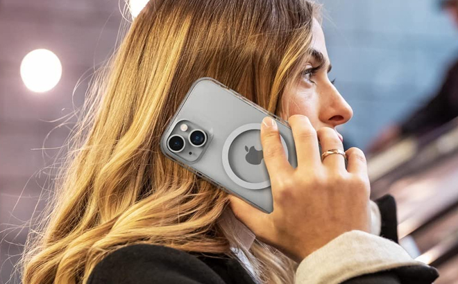 A Lady holding an iPhone with ZAGG Gear4 Crystal Palace Snap Case