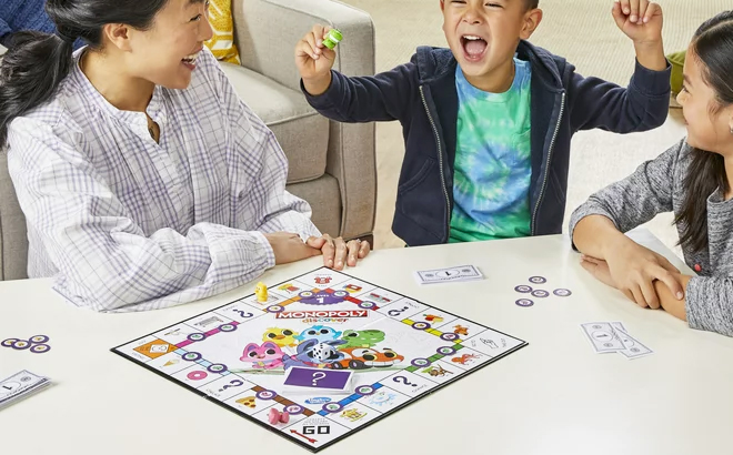 A family playing Monopoly Discover Board Game
