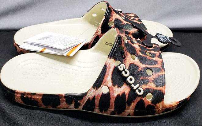 Crocs Classic Animal Remix Adult Slide Sandals on Top of Black Cloth