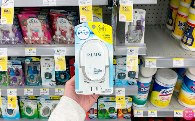 Febreze Plug Oil Warmer in Front of a Shelf at Walgreens Store