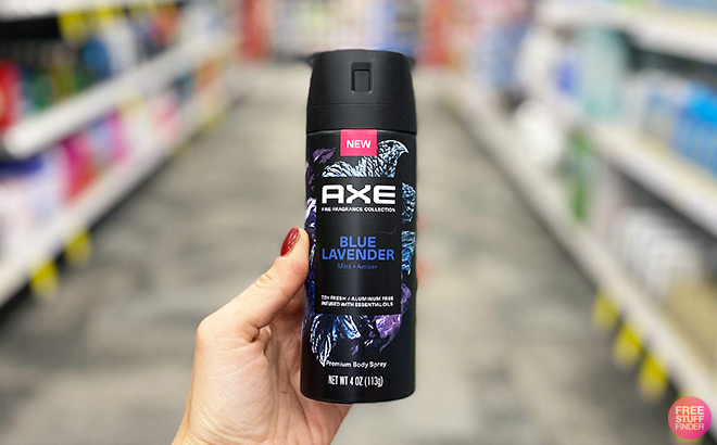 Hand Holding Blue Lavander Axe Fragrance in a Store