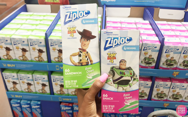 Hand Holding Boxes of Ziplock Pixar Sandwich and Snack Bags Hand Holding Bozes of Ziplock Pixar Sandwich and Snack Bags