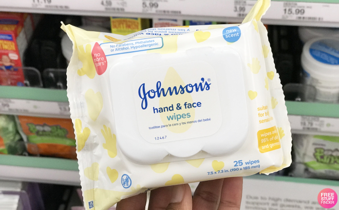 Hand Holding Johnsons Baby Hand Face Wipes