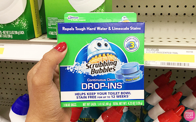 Hand Holding Scrubbing Bubbles Continuous Clean Drop Ins Toilet Cleaner Tablets