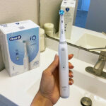 Hand holding Oral B iO Series 3 Electric Toothbrush