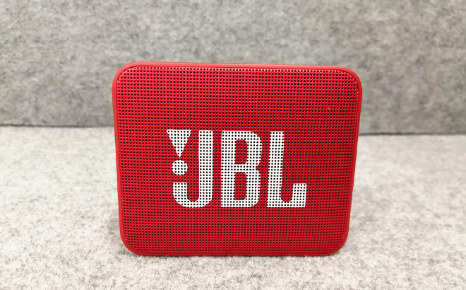JBL GO2 Portable Bluetooth Speaker on a Couch