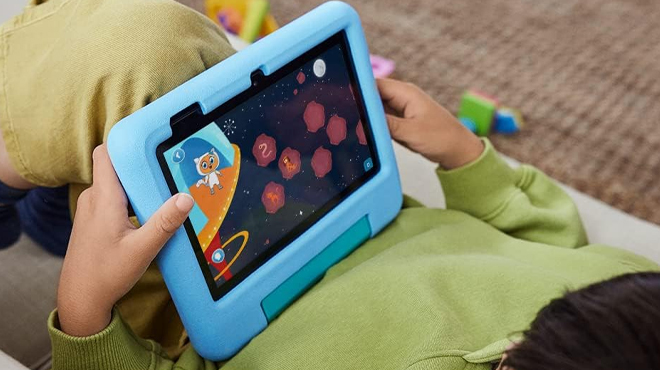Kid Using the Fire 7 Kids Tablet in Blue Color
