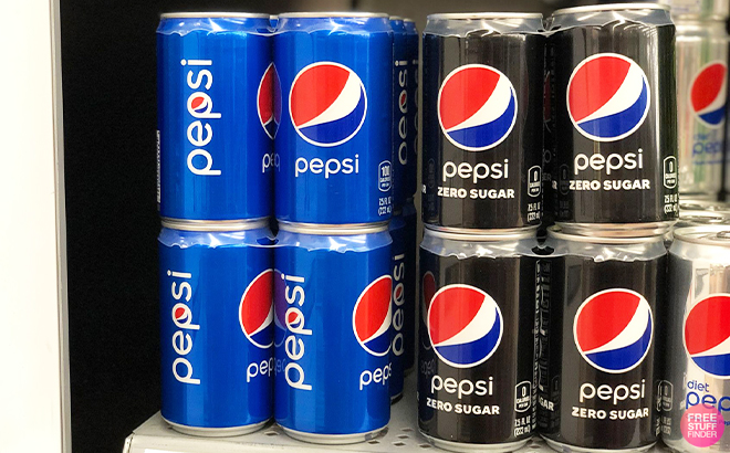Multiple Pepsi Soda Cans on a Shelf