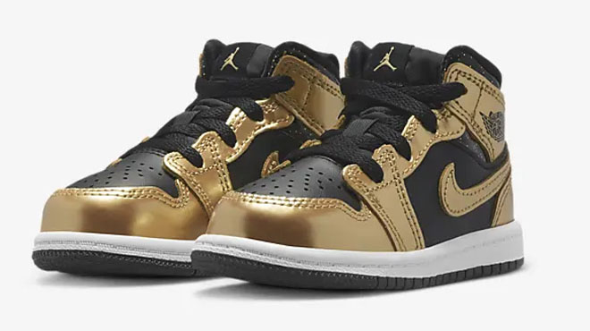 Nike Jordan 1 Toddler Shoes in Gold on Gray Background