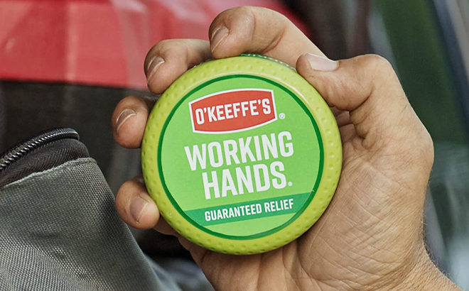 Person Holding OKeeffes Working Hands Cream