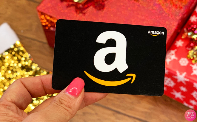 Person Holding a Black Amazon Gift Card