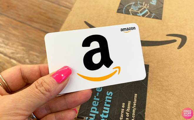 Person Holding a White Amazon Gift Card