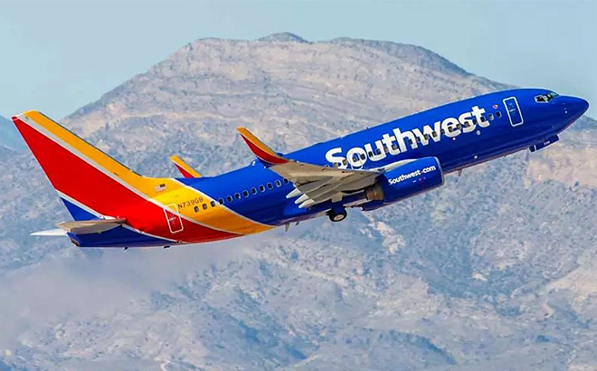 Southwest Airplane Flying over a Mountain Landscape