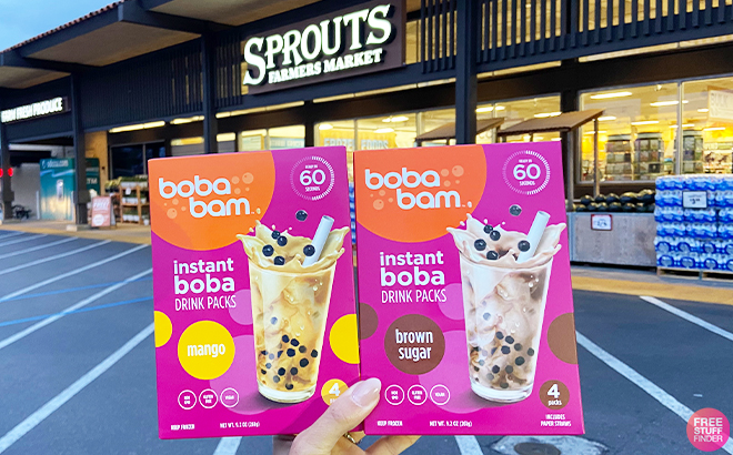 Woman Holding 2 Boba Bam Brown Sugar Instant Boba Drink Kit at Sprouts