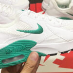 Woman Holding Nike Air Max Excee Womens Shoes in Neptune Green Color