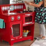 a Girl Playing with a KidKraft Classic Kitchenette Play Set