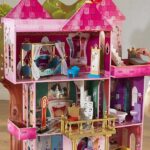 a Girl Playing with a KidKraft Storybook Mansion Dollhouse
