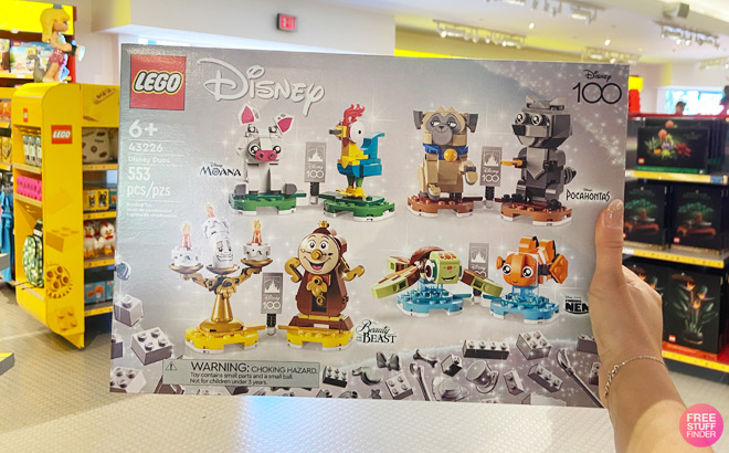 a Hand Holding LEGO Disney Beauty and The Beast Duos Set