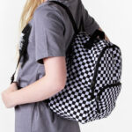 a Person Carrying a Vans Off the Wall Mini Checkered Backpack
