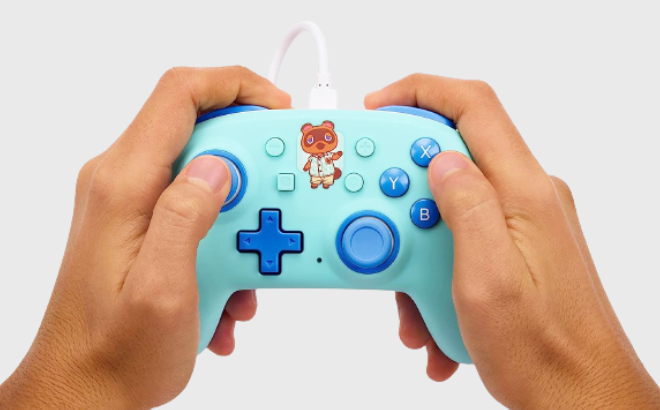 A Guy Playing Using His Nintendo Switch Wired Controller