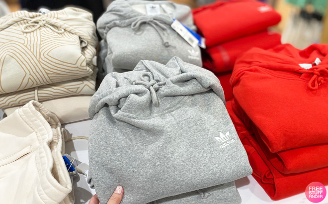 Folded Adidas Hoodies on Shelf
