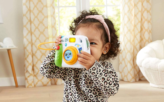 Child Playing with LeapFrog Fun 2 3 Instant Camera